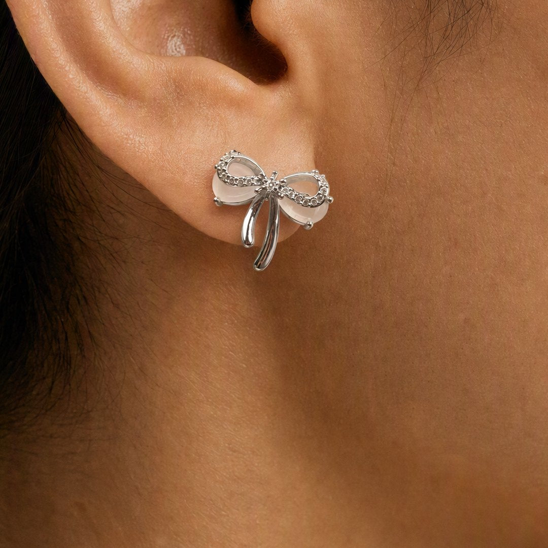 Silver Bow Stud Earrings worn on model view 4